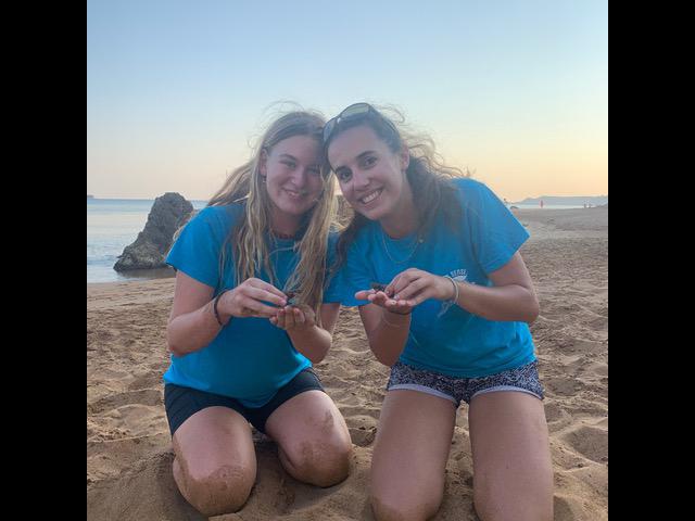 Mia and Amelie holding the first hatchlings of the season