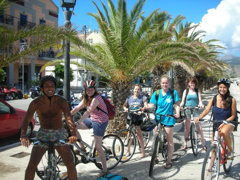 Volunteers cycling in Argostoli Harbour