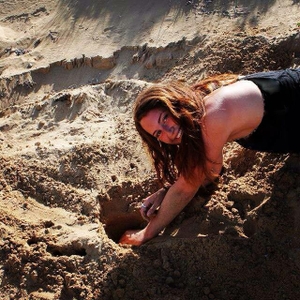 Rachel Byrne locating a sea turtle nest