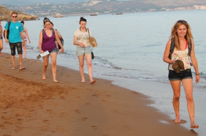 volunteers walking the beach